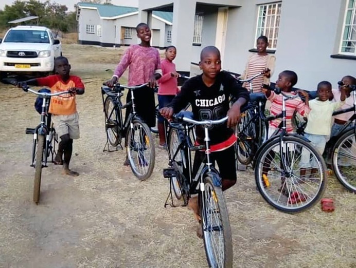 Children at the Nyadire Mission’s Home of Hope orphanage in Mutoko, Zimbabwe, pose with new bikes provided by Dutilh United Methodist Church in Pittsburgh. Photo by Mary Beth Zollars. 