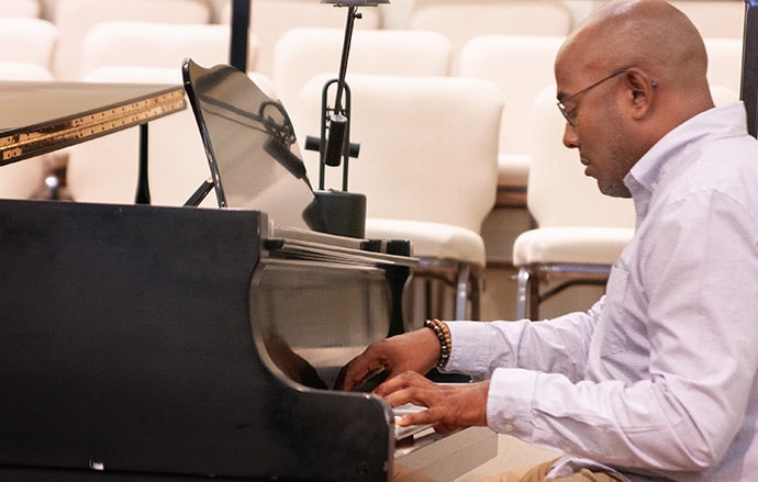 Raymond Trapp, the worship and music director at the 2020 General Conference, practices a hymn ahead of worship during the Commission on General Conference meeting in Lexington, Ky. Sessions of the 2020 General Conference will begin with worship every day. Photo by Heather Hahn, UM News.