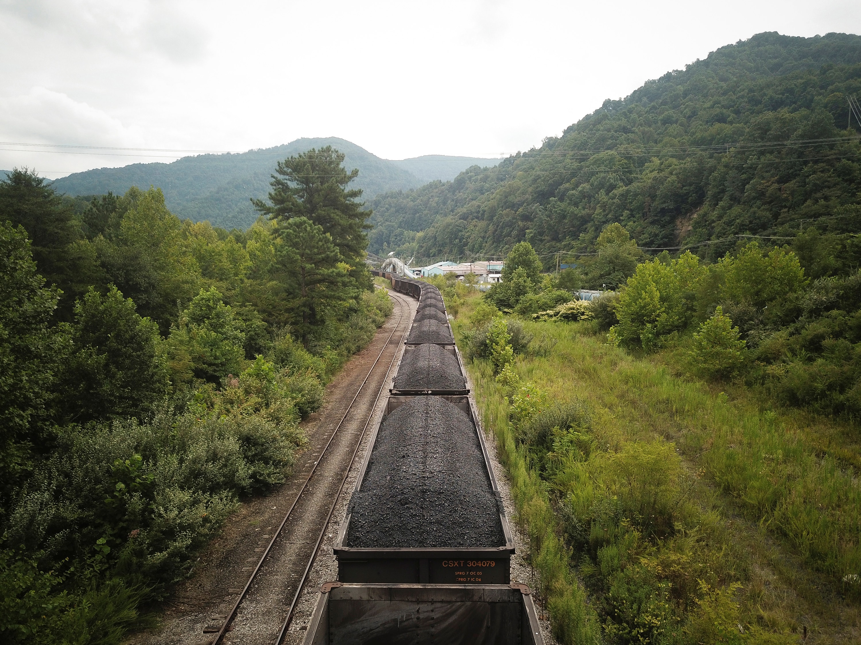 A train loaded with coal sits on the tracks inside the now-bankrupt mining company Blackjewel's former Black Mountain mining complex. United Methodist churches have stepped up to offer food, school supplies and help with utility bills to out-of-work miners. Photo by Charles Mostoller/Reuters photo