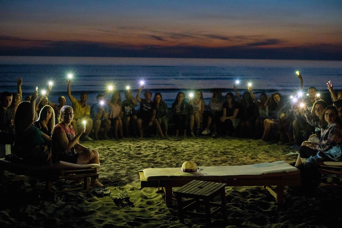 About 30 young people from Albania, Macedonia and Serbia gathered for the second United Methodist Regional Youth Camp in the coastal area of Spille, Albania. A sunset visit to the beach turned into an impromptu worship service for as those in attendance gathered in a circle and “praised the Lord.” Photo by Danail Ristovski, Skopje/Macedonia.