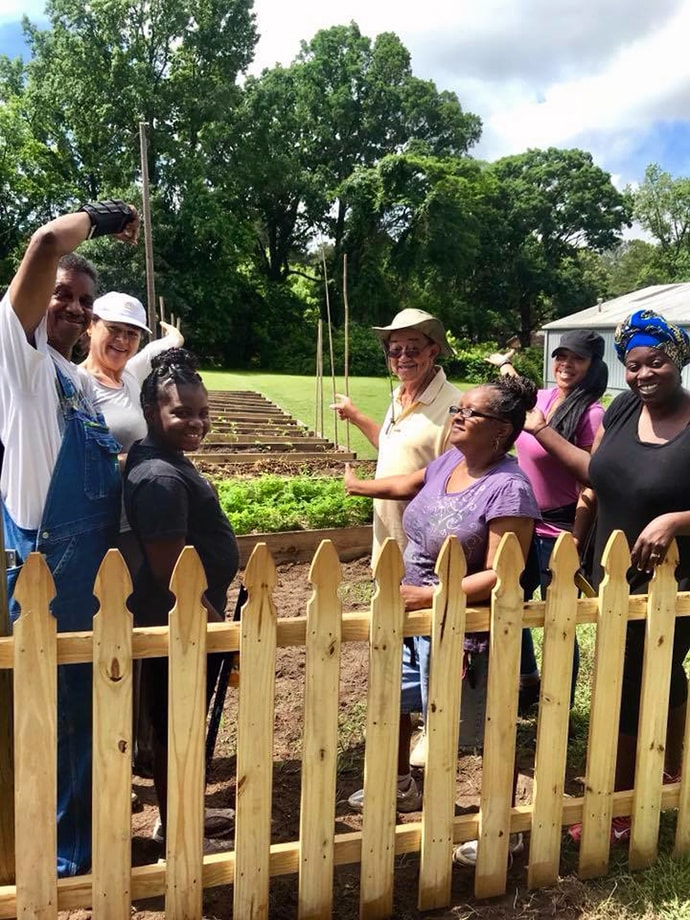Volunteers at the community garden at Columbia Drive United Methodist Church in Decatur, Ga., take a break. Photo courtesy of Columbia Drive United Methodist Church.