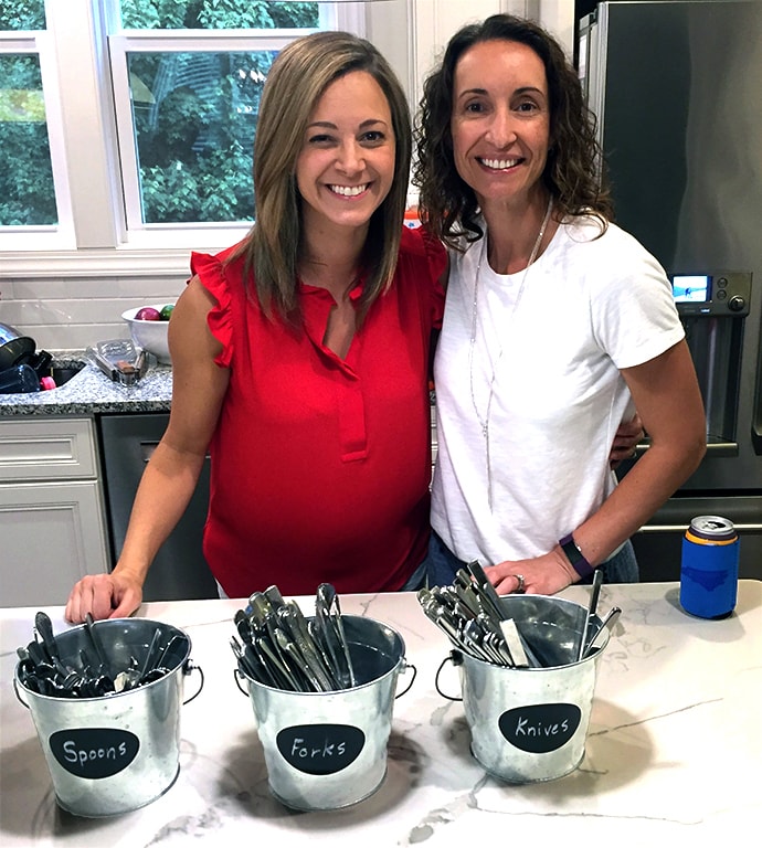 Celina Mount (left) and Lynette Mittendorf with spoons, forks and knives that are part of the silverware lending library at First United Methodist Cary in North Carolina. Photo courtesy of First United Methodist Cary in North Carolina.