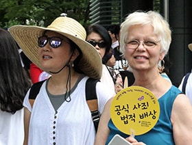 The Revs. HiRho Park and Kathryn Armistead were among those attending the seventh memorial day for comfort women in Seoul. Comfort women were women and girls who were forced into sexual slavery by the Japanese Army during World War II. Photo by the Rev. Thomas Kim, UM News.