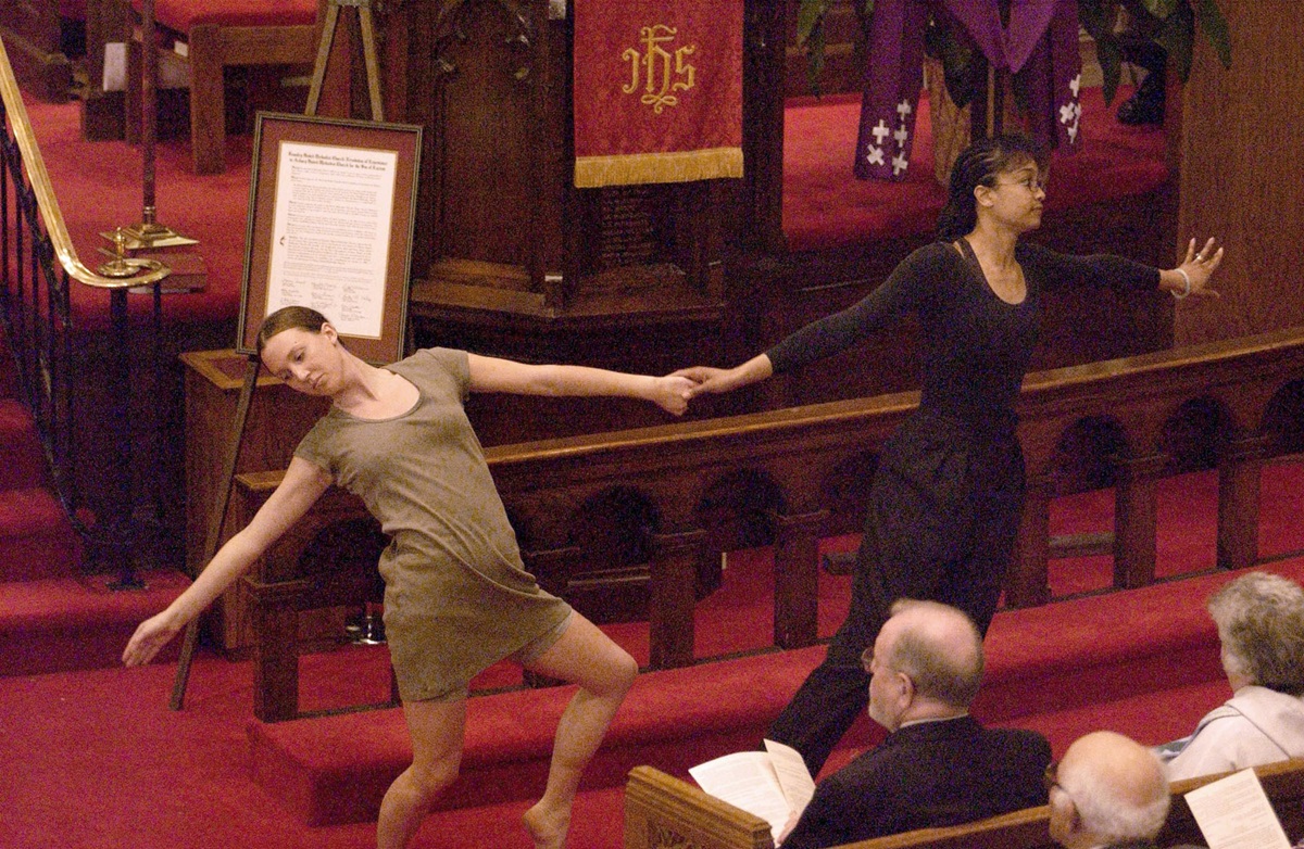 Kimberly Pitcher-Crago (left) and Ellen Hawes present a liturgical dance during a 2002 service of repentance by Foundry United Methodist Church at Asbury United Methodist Church in Washington. In the 19th century, racial discrimination at Foundry led to the formation of Asbury and later John Wesley AME Zion. File photo © Jay Mallin.