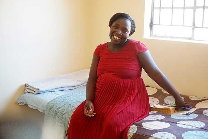 Emelda Chikami shows off her accommodations at Old Mutare Mission Hospital in Mutare, Zimbabwe, where she will stay until her baby arrives. Chikami and other expectant mothers are helping tend to the hospital's garden, which provides fresh vegetables to the women during their stays. Photo by Kudzai Chingwe, UM News.