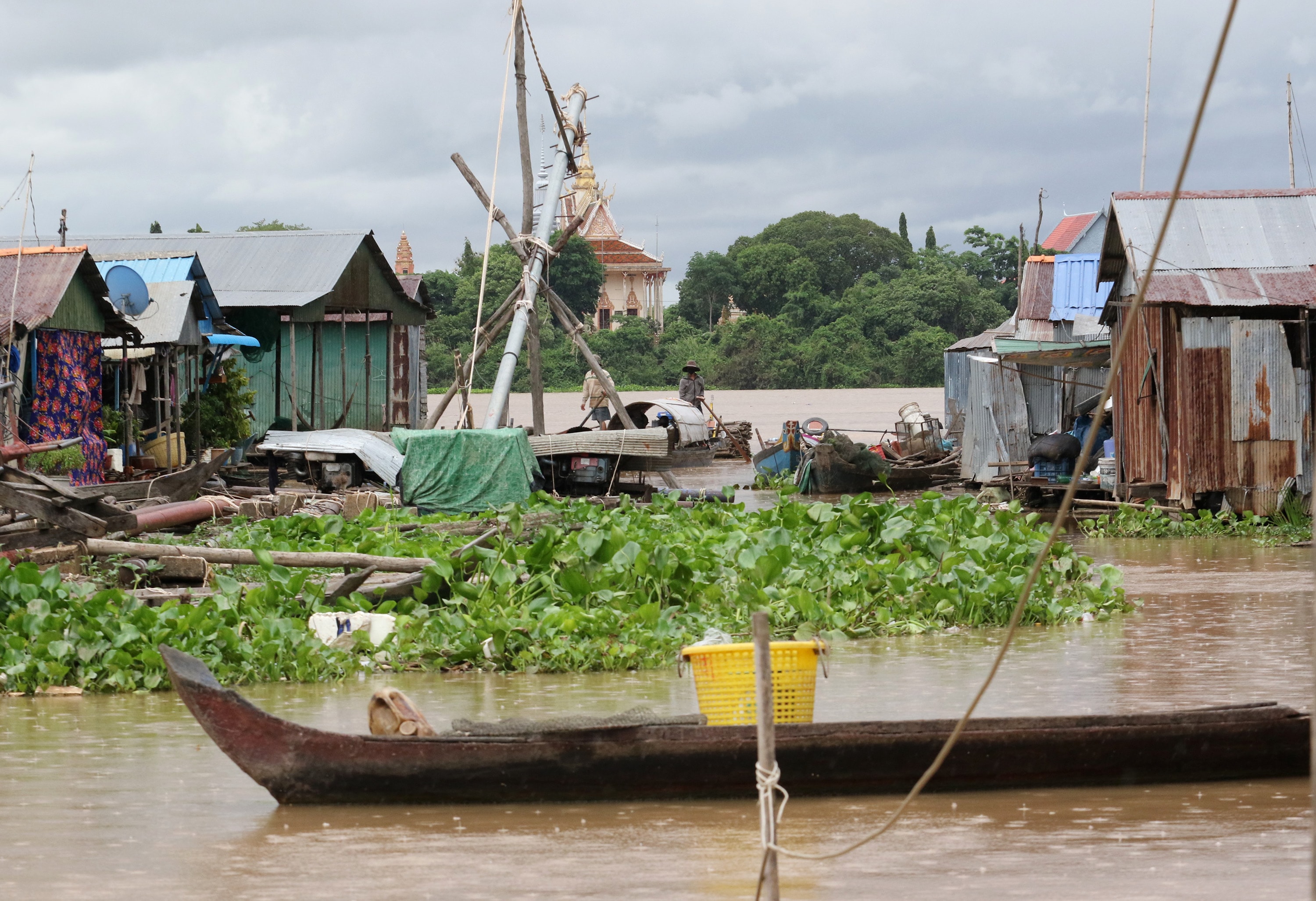 Villagers travel by boat to their home in a floating village on the Tonle Sap River near Phnom Penh, Cambodia. A United Methodist team visited the area to explore ways the church can help fight human trafficking. Photo by the Rev. Thomas Kim, UM News.