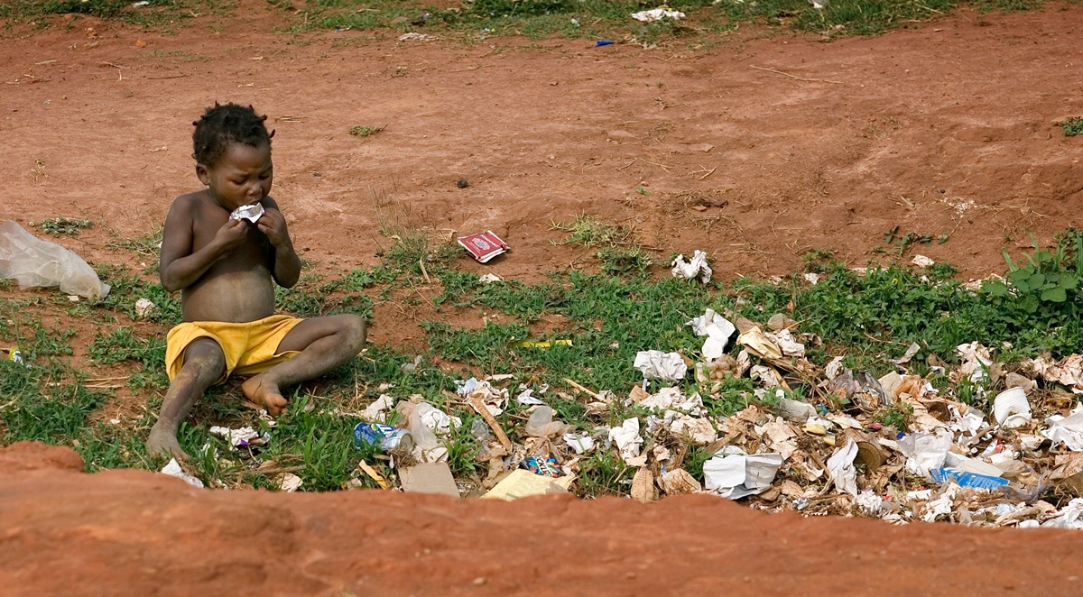 A child scavenges for food in a garbage pit just outside the Hope for the Children of Africa School near Malanje, Angola, in 2006. The school was named for the United Methodist Council of Bishops' appeal that provided funds for its construction. World hunger can be wiped out by 2030 according to the Bread for the World Institute. File photo by Mike DuBose, UM News.