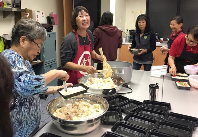 Volunteers pack meals for the Blessed Bento program at Faith United Methodist Church in Torrance, Calif. The Rev. Allison Mark describes the program as the church’s "healthy Japanese meals on wheels" program. Photo courtesy of Faith United Methodist Church.