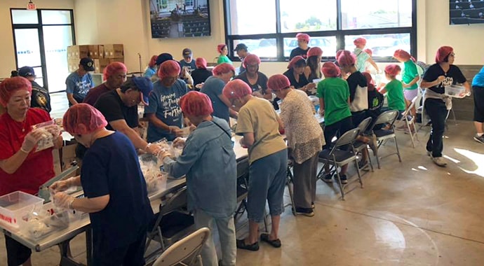 Volunteers at Faith United Methodist Church in Torrance, Calif., in partnership with the Rise Against Hunger organization. Photo courtesy of Faith United Methodist Church.