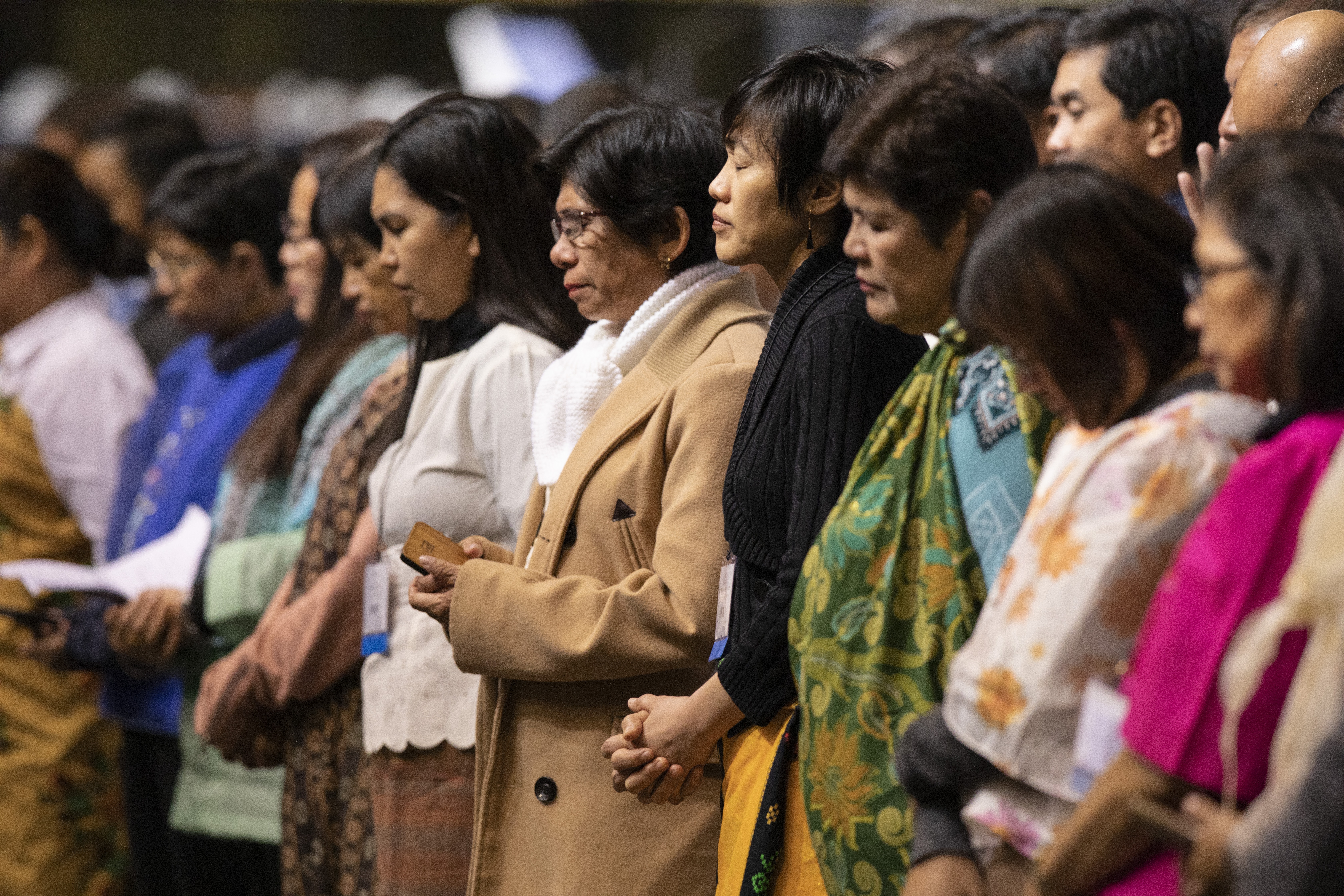 Delegates from the Philippines bow their heads during a day of prayer at the 2019 United Methodist General Conference in St. Louis. A group of Filipino United Methodists have submitted a plan to the 2020 General Conference that calls for church unity, not division. Photo by Kathleen Barry, UM News.