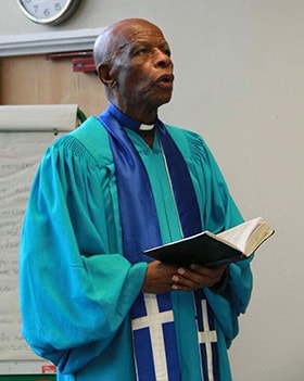 The Rev. Andrew Mhondoro, a tailor and United Methodist pastor, sewed the clergy shirts and gowns for many of Zimbabwe’s United Methodist pastors. Mhondoro died Sept. 29 at age 82. Photo courtesy of The UMC UK Media & Publications.