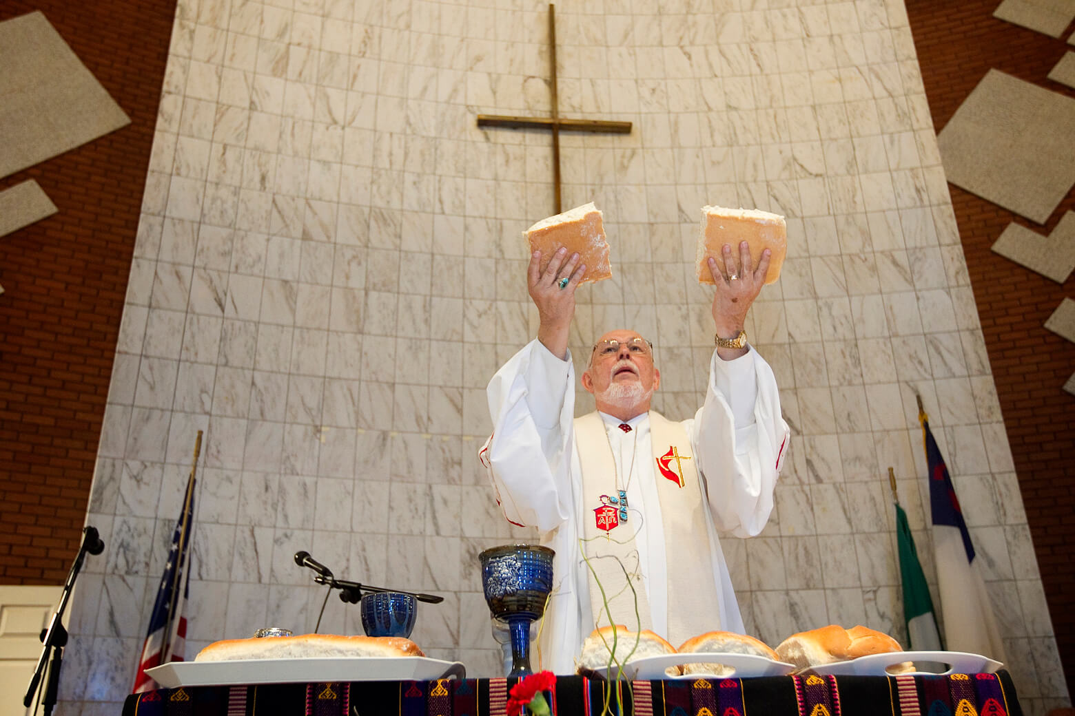 Bishop Joel N. Martinez blesses the elements of Holy Communion during opening worship at the 2011 MARCHA meeting at the Lydia Patterson Institute in El Paso, Texas. File photo by Mike DuBose, UMNS.