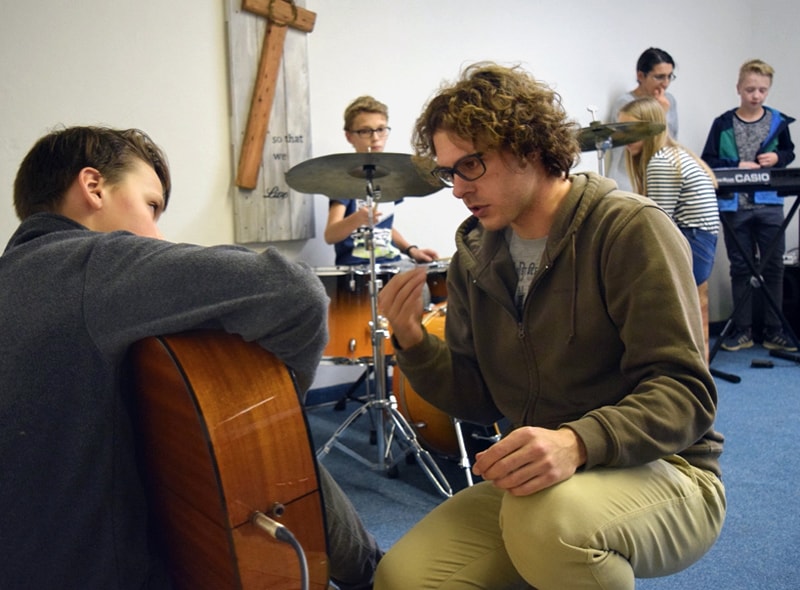 In addition to leading church services in Dolný Kubín, Slovakia, the Rev. Patrik Hipp along with his wife, Zuzana Hipp, and helpers established the FUSION Music Ministry, a group of young people (pictured) who meet to make music together. Photo courtesy of Rev. Patrik Hipp.