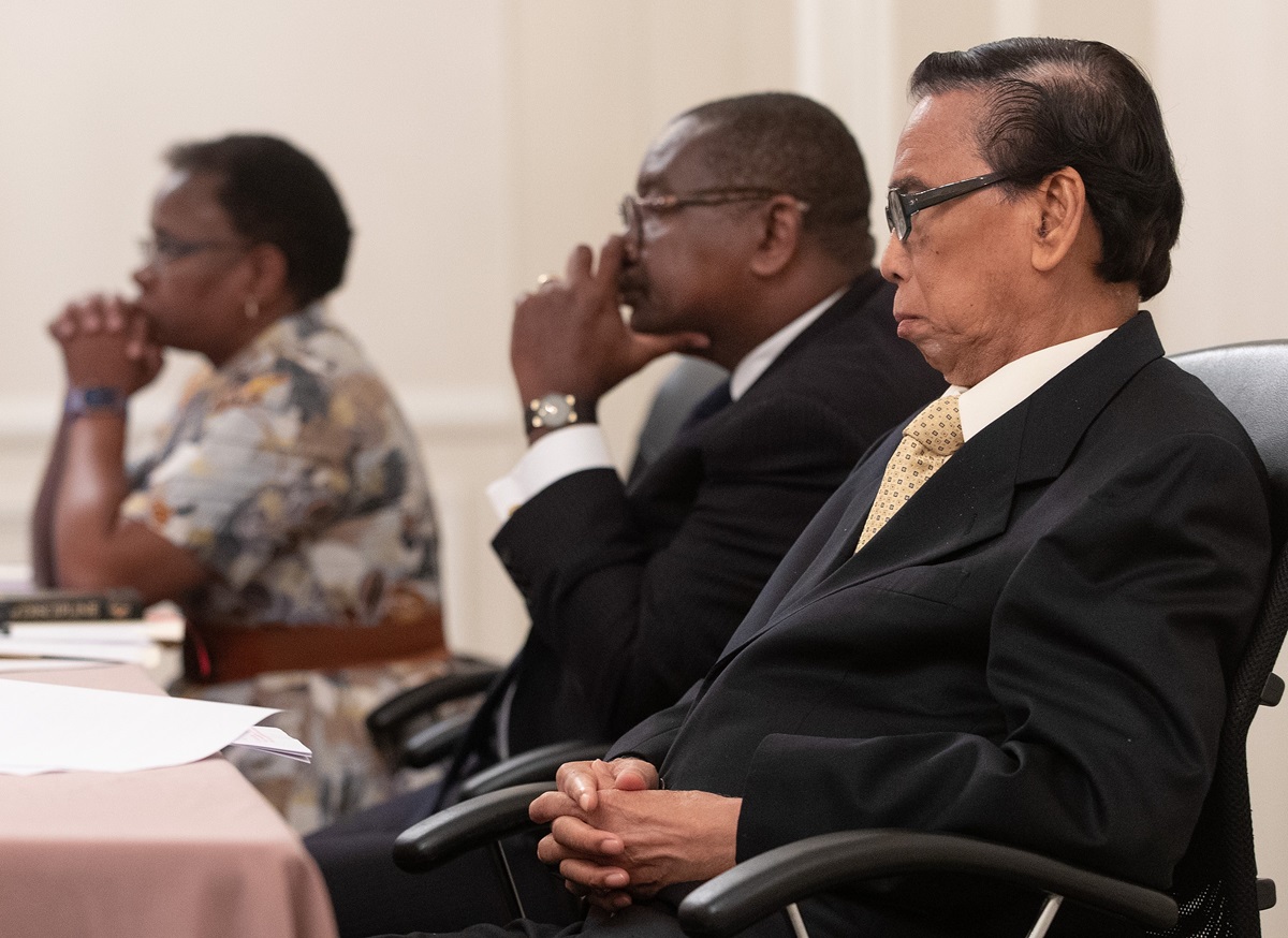 Members of the United Methodist Judicial Council listen during an oral hearing at their meeting in Evanston, Ill. From left are: the Rev. J. Kabamba Kiboko, N. Oswald Tweh Sr. and Ruben T. Reyes. Photo by Mike DuBose, UM News.