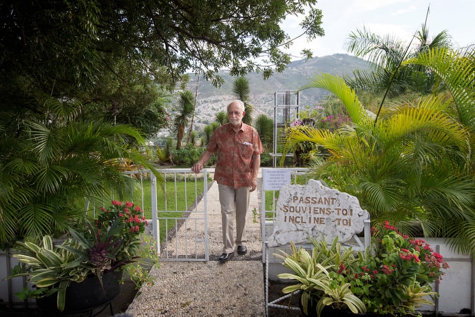 The Rev. James Gulley walks through a memorial garden in 2014 for those killed during the Haiti earthquake at the Hotel Montana in Port-au-Prince. Gulley survived the hotel's collapse, after being trapped for 55 hours beneath the rubble. The Revs. Sam Dixon and Clinton Rabb, who were trapped with Gulley, died of their injuries. File photo by Mike DuBose, UM News.