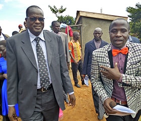 United Methodist deacon Joseph Zalambi, right, gives Bishop Daniel Wandabula of the East Africa Episcopal Area a tour of the new Magooli Academy for Children in Lugala, Uganda, at the school’s dedication in September. Photo by Vivian Agaba, UM News.