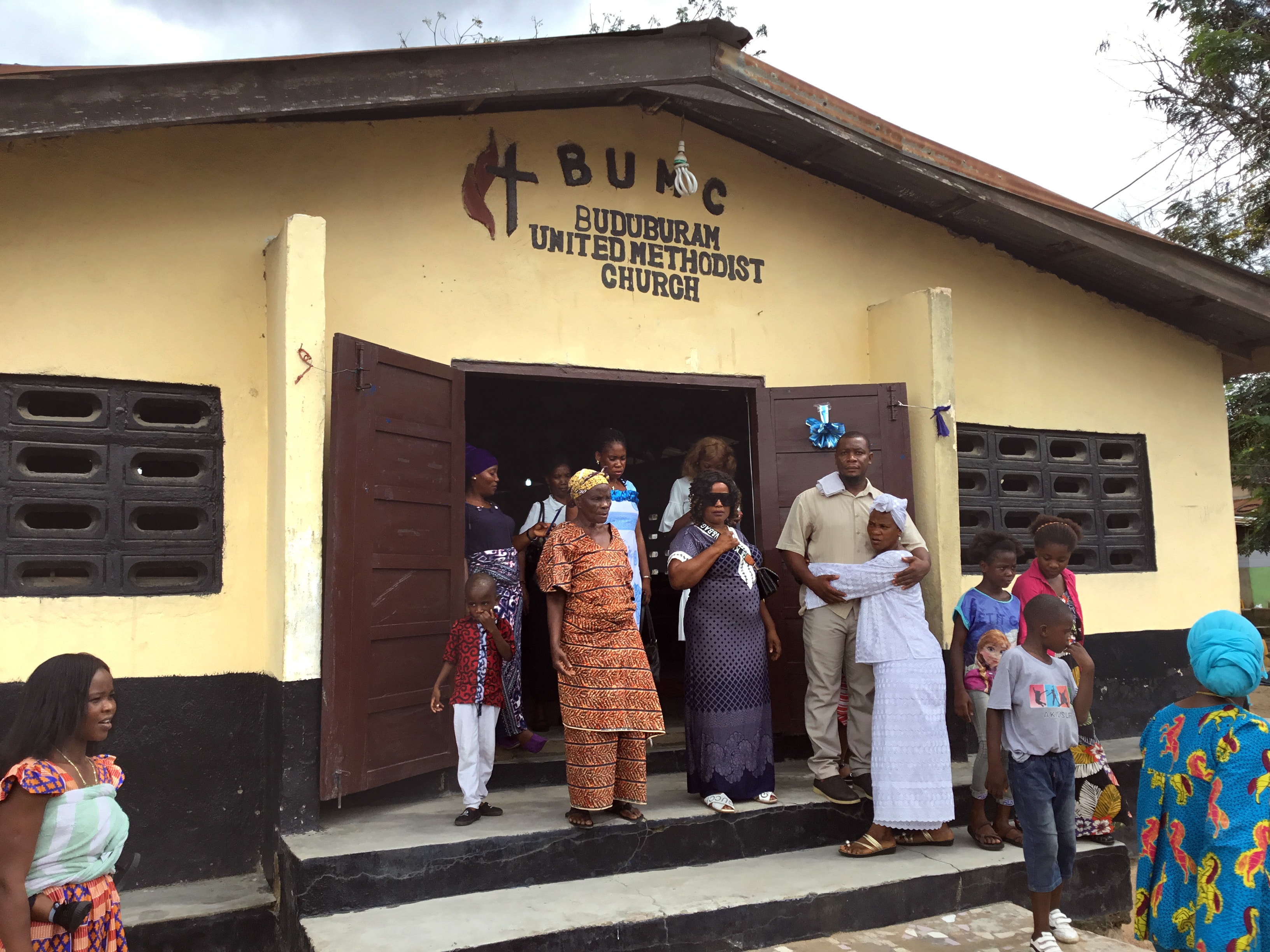 Members of Buduburam United Methodist Church in Buduburam, Ghana, leave after worship on Nov. 3. The church’s pastor, the Rev. James Y. Kaifunbah, is asking for support from the Liberia Conference and global United Methodist Church to help save the small parish. Photo by E Julu Swen, UM News.