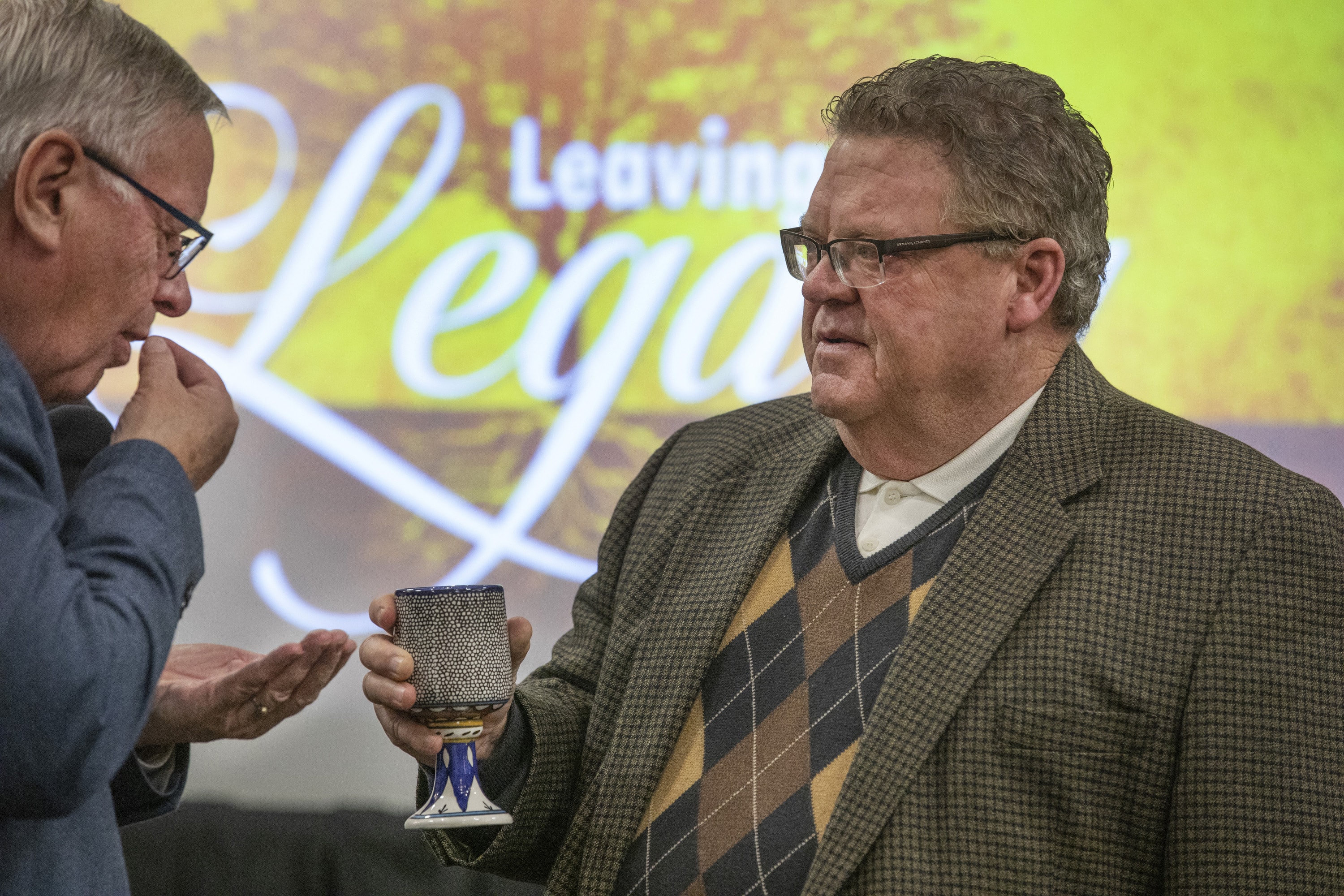 Per-Endre Bjørnevik (left), a General Council on Finance and Administration board member from Norway, receives communion from the Rev. Steve Wood, board member from the North Georgia Conference. During the board meeting Nov. 14-15 in Nashville, Tenn., the GCFA board responded to a letter from European bishops objecting to cuts to office expenses. Photo by Kathleen Barry, UM News. 