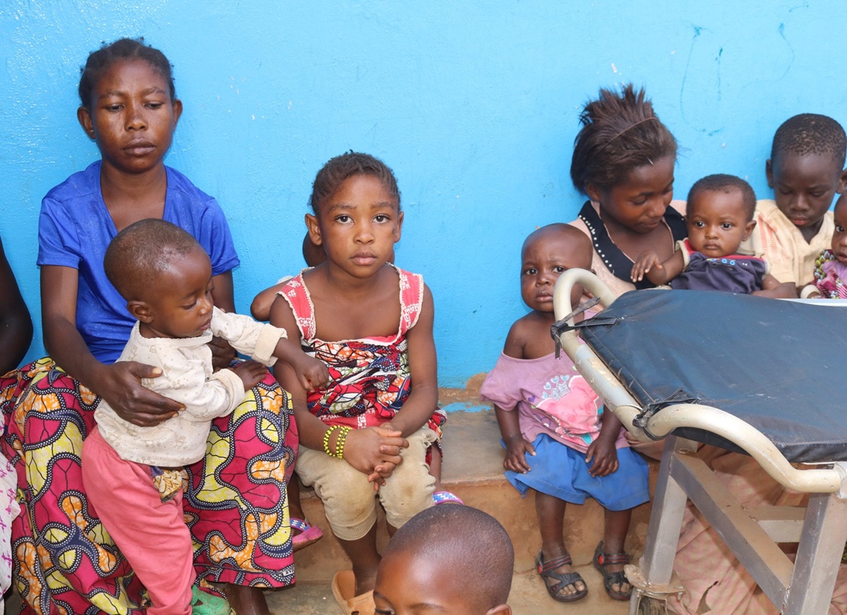 Solange Cabwene (in blue shirt), a mother of two, brought her children to the United Methodist Irambo Health Center in Bukavu, Congo, for treatment for malnutrition. She joined The United Methodist Church's Vulnerable Association of Savings and Credit to help pay for her medical bills. “This helped me because the association gave me a credit (loan) and today I start selling embers, and my two children (will) not relapse," she said. Photo by Philippe Kituka Lolonga, UM News.