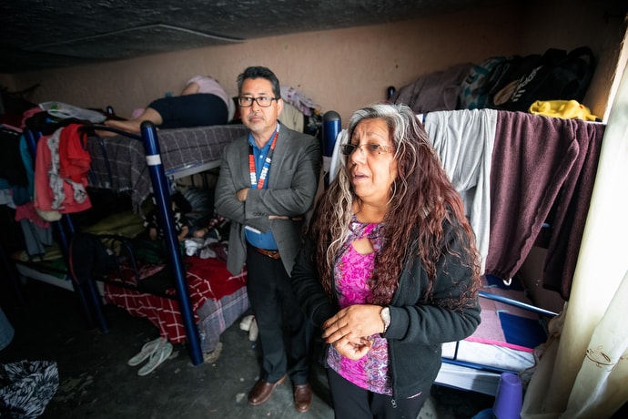 Dolores Fierro (right) offers a tour for members of the United Methodist Immigration Task Force of El Buen Samaritano, a shelter for migrants operated by the Methodist Church of Mexico in Juárez. At center is the Rev. John Oda, a member of the task force. Photo by Mike DuBose, UM News.