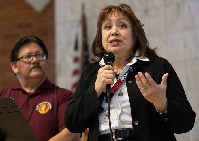 Bishop Minerva G. Carcaño addresses the United Methodist Immigration Summit meeting at Lydia Patterson Institute in El Paso, Texas. At left is the Rev. Santiago Heredia, who serves as chaplain at Lydia Patterson. Photo by Mike DuBose, UM News.
