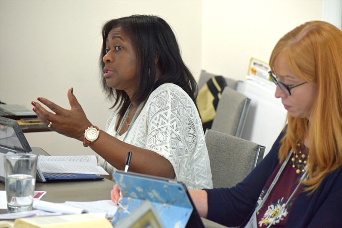 The Rev. Sharon Austin, Florida Conference director of Connectional and Justice Ministries, and Carla Works, professor at Wesley Theological Seminary, work on the Revised Social Principles during a writing session in Washington. Photo courtesy of United Methodist Board of Church and Society.