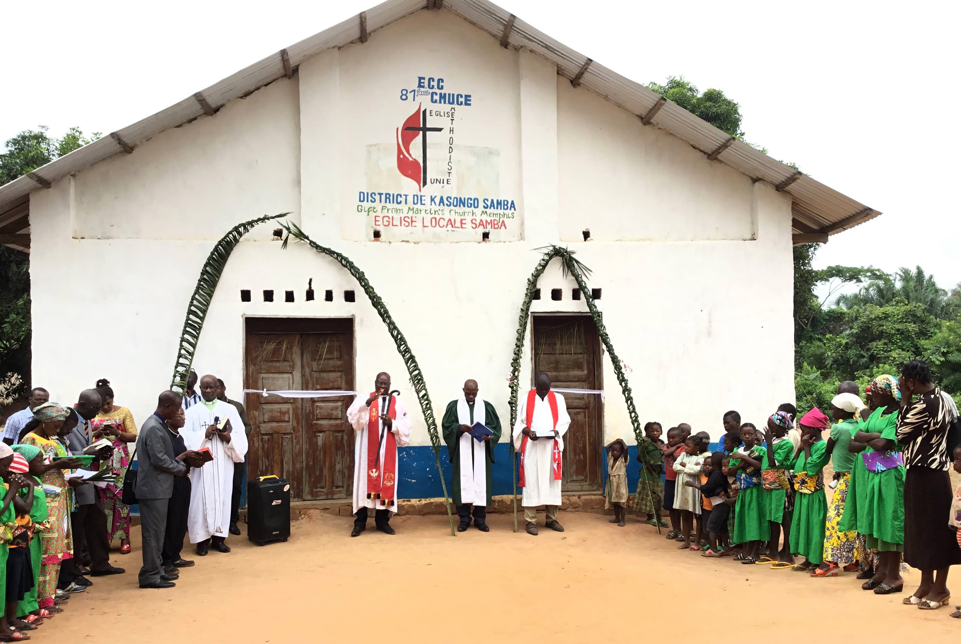 East Congo Bishop Gabriel Yemba Unda dedicates Samba United Methodist Church in the Kasongo-Samba District, which is nearly 250 miles from the bishop’s office. During his 10-day trip, Unda dedicated more than 10 churches built with the help of United Methodist partnerships and local contributions. Photo by Judith Osongo Yanga, UM News.