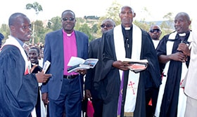 Bishop Daniel Wandabula of the East Africa Episcopal Area (second from left) presides over the dedication of Saint Paul United Methodist Church in Murehe, Burundi. United Methodists in the Murehe District and others from the Burundi Conference raised the $145,000 needed to build the new church. Photo by Pepi Mbabaye, UM News.