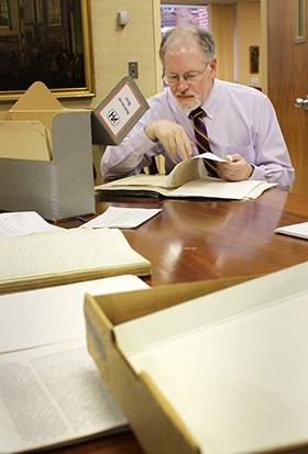 L. Dale Patterson studies papers from the archives at the United Methodist Commission on Archives and History at Drew University in Madison, New Jersey. A 2010 file photo by Kathleen Barry, UM News. 