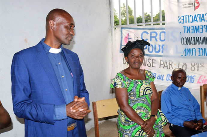 The Rev. Kabaiza Hatari, Fizi District superintendent, and his wife, Bukuru Hatari, encourage women who are taking classes at a new United Methodist-run vocational training center in Fizi, Congo. More than 100 women and 50 youth currently are receiving weekly training at the center. Photo by Philippe Kituka Lolonga, UM News.