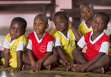 Children listen to a vocabulary lesson at the Bethlehem Day Care Center in Youhoulil, Côte d'Ivoire. The United Methodist Women’s organization in the Dabou District started the program in 2016 to help provide nutrition and education for the children of local farmers.