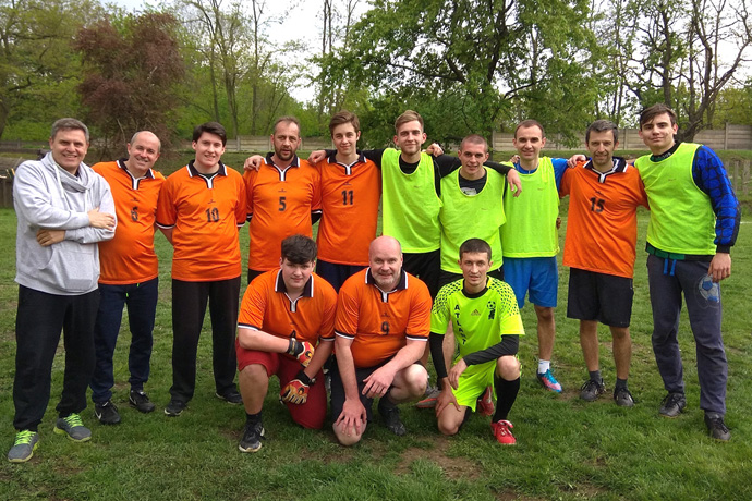 The Rev. Lev Shults (left in grey), is a successful soccer coach in addition to being a pastor. Shults leads the Russian-speaking Agape United Methodist Church, among 23 local parishes of The United Methodist Church in Czechia. Photo by Urs Schweizer, Central Conference of Central and Southern Europe.