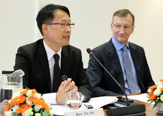 The Rev. Jin Yang Kim (left) speaks during the World Council of Churches live-stream event held Feb. 6, 2020. Looking on is Peter Prove, director of the Commission of the Churches on International Affairs.  Photo by Ivars Kupcis, World Council of Churches.