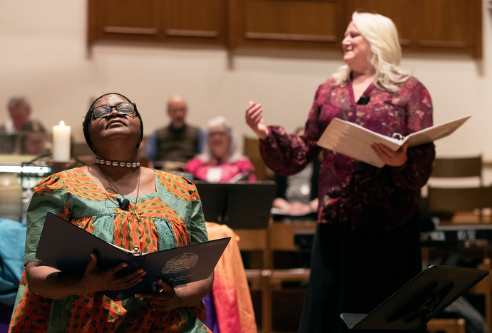 The Rev. Grace Imathiu (left) and Marcia McFee lead opening worship for the Connection 2020 gathering sponsored by Reconciling Ministries Network at Belmont United Methodist Church in Nashville, Tenn. Photo by Mike DuBose, UM News.