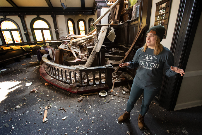 Kylan Hadley describes tornado damage to East End United Methodist Church in Nashville, Tenn. Hadley is the church's youth director. Photo by Mike DuBose, UM News.