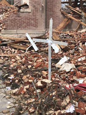 A cross stands amid rubble at Dodson Chapel United Methodist Church in Hermitage, Tenn. The church was devastated by storms in Nashville and central Tennessee on March 3. Photo by the Rev. Chris Seifert.