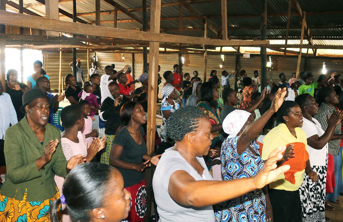 The congregation of Glen-View East United Methodist Church celebrates in worship at the Tichagarika Shopping Center in Harare, Zimbabwe. The church holds lunch-hour services at the market on Wednesdays and Saturdays. Photo by the Rev. Taurai Emmanuel Maforo, UM News.