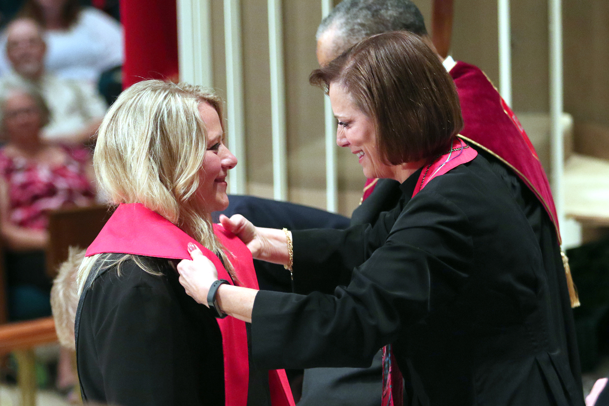 Tiffany Nagel Monroe (left) receives the stole of an elder from the Rev. Linda Harker during a service of ordination June 1, 2016, at St. Luke's United Methodist Church, in Oklahoma City. A report by the Ministry Study Commission about the future of the ordination ministry was presented during the pre-General Conference 2020 briefing held Jan. 23-24 in Nashville. File photo by Hugh W. Scott, Oklahoma Conference.