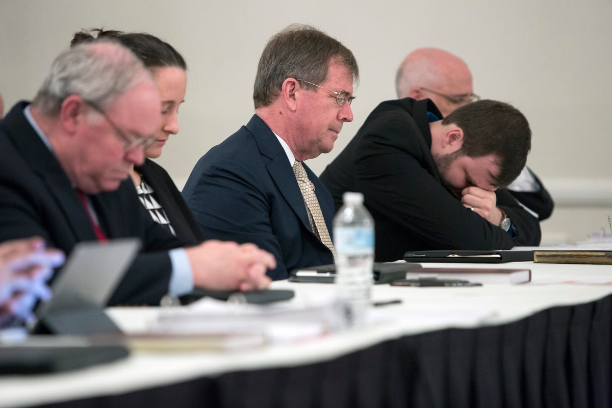 People who had submitted briefs to the United Methodist Judicial Council pray prior to a May 2018 oral hearing in Evanston, Ill. From left are the Rev. Keith Boyette, Stephanie Henry, Bishop Scott Jones, John Lomperis and Thomas E. Starnes. Boyette, Jones and Lomperis were among 28 United Methodists who signed a statement from a meeting in Atlanta about the formation of a new traditionalist denomination. File photo by Kathleen Barry, UM News.