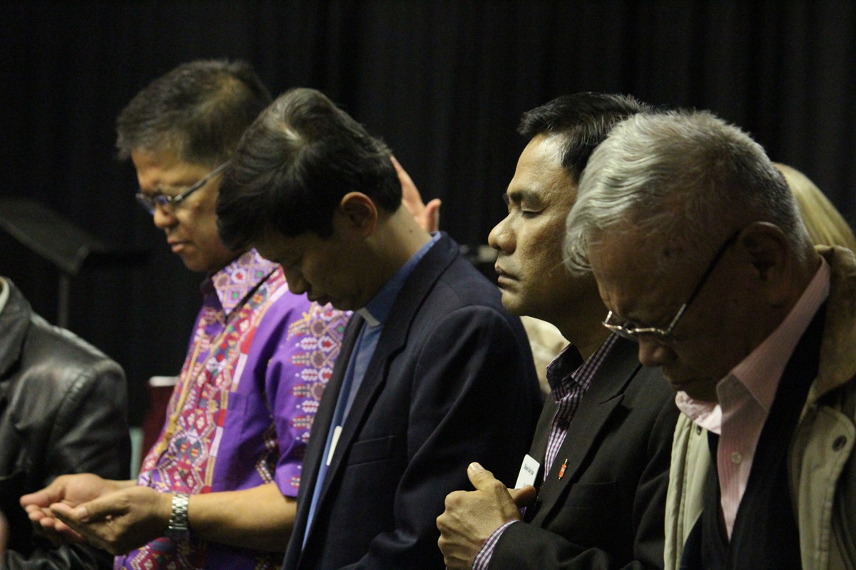Filipino bishops Ciriaco Q. Francisco (from left), Pedro Torio Jr., Rodolfo A. Juan and Emerito Nacpil (retired) pray during a 2013 meeting of the Council of Bishops. In response to the coronavirus, the active bishops postponed 17 annual conferences in the Philippines indefinitely. File photo by Andrew Jensen.