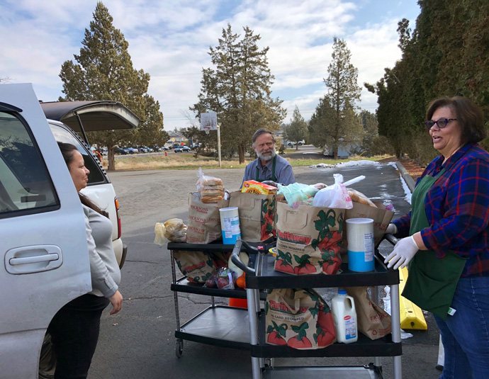 With gatherings limited due to the coronavirus outbreak, Madras United Methodist Church, in Madras, Oregon, shifted to drive-thru pickup for the community food pantry it houses. Photo courtesy of Madras United Methodist Church.