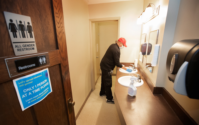 Custodian James Jimmerson disinfects a bathroom to prevent any possible spread of the coronavirus at Belmont United Methodist Church in Nashville, Tenn., on Sunday, May 10, 2020, after online worship, which was recorded in the sanctuary. “These bathrooms are the custodians’ pride and joy,” he said. Photo by Mike DuBose, UM News.