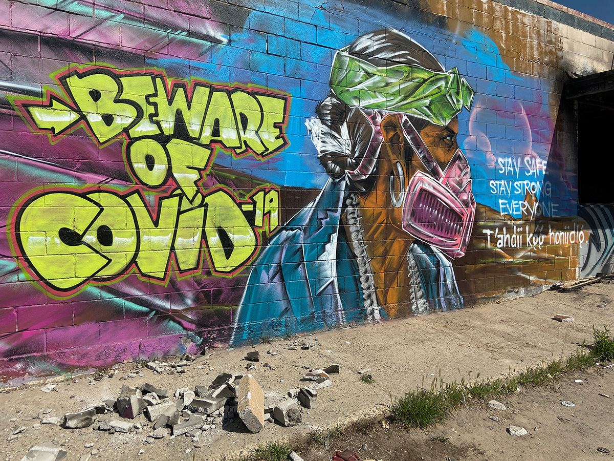 A mural warns residents of the danger posed by the COVID-19 outbreak in the Navajo Nation near Shiprock, N.M. The United Methodist Church’s Four Corners Native American Ministry is helping support tribal members and front-line workers on the reservation. Photo by Andrew Hay, REUTERS.