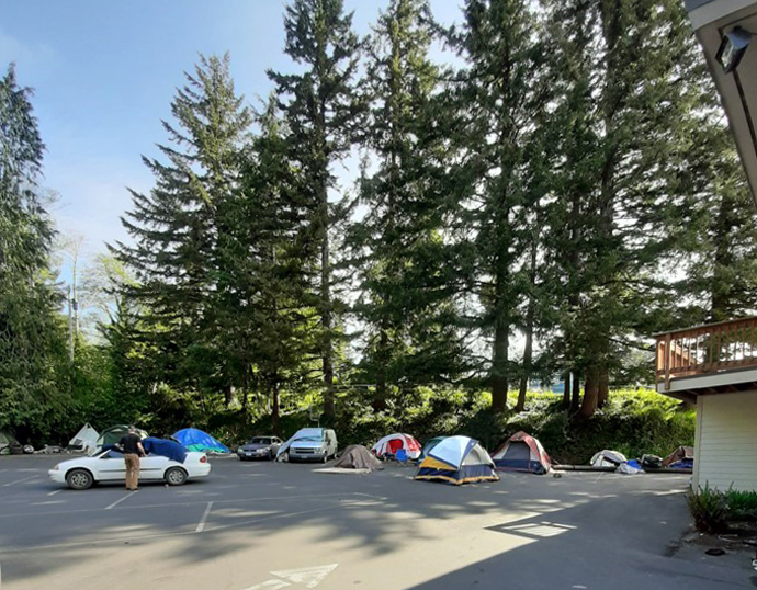 Tents and shelters set up outside Harmony United Methodist Church Coos Bay, Ore., are part of camp for the homeless that began in February 2019 with one homeless person who had no place to go. For the approximately 80 campers on the parking lot, the day begins with coffee in the parking lot made by church members who also put out donated breakfast food like donuts. Photo courtesy of the Rev. Don Ford.