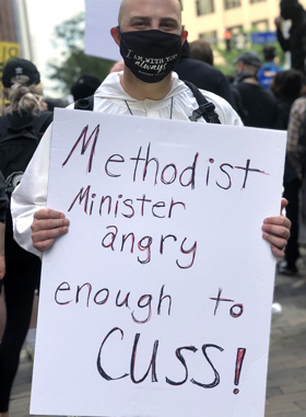 Trent Somes III holds a sign during the Pittsburg protest. Photo by the Rev. Dawn M. Hand, courtesy of the Western Pennsylvania Conference.