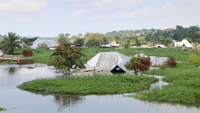 Thousands of homes in Kindu, Congo, were submerged by the waters of the Congo River in April. Although the water has receded, the river is still flooded. The United Methodist Church in Congo has been providing food for flood survivors who have been displaced. Photo by Chadrack Londe, UM News.