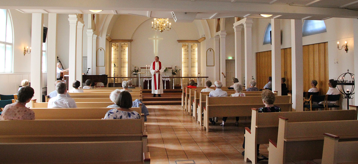 On Pentecost, the congregation of The United Methodist Church Porsgrunn in Norway had to sit apart, using every second pew. Only 50 people were admitted for worship because of the threat of the coronavirus. Photo courtesy of The United Methodist Church Porsgrunn.