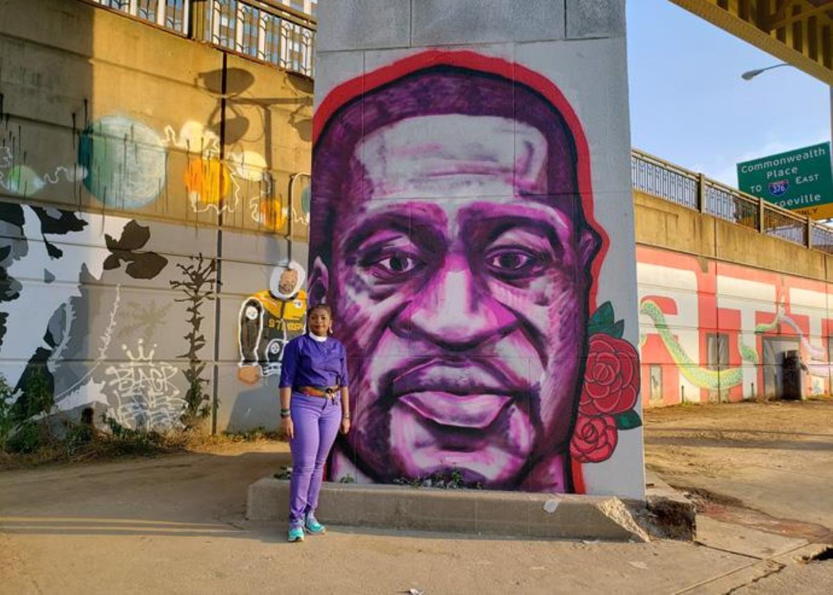 Western Pennsylvania Area Bishop Cynthia Moore-Koikoi stands in front of an image of George Floyd painted on an overpass support in Pittsburgh,. Floyd, a black man, was killed in Minneapolis, Minn., when a white police officer knelt on his neck for nearly 9 minutes. Photo by Jackie Campbell, Western Pennsylvania Conference.