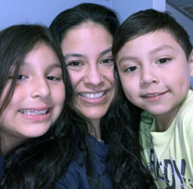 Claudia Marchan (center), executive director for North Illinois Justice for Our Neighbors, with her daughter Ximena, and son Enrique. Marchan is a DACA recipient. Photo courtesy of Justice for Our Neighbors website.
