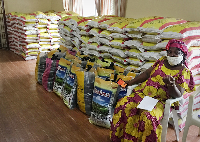 Muriel V. Nelson, head of the church’s Anti COVID-19 Taskforce, sits in front of relief supplies in her office in Monrovia, Liberia. The church is distributing food, including rice and beans, to physically challenged and elderly members struggling during the pandemic. Photo by E Julu Swen, UM News.